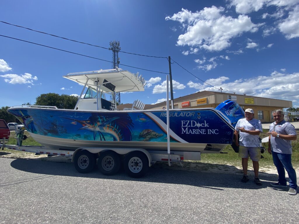 Boat graphics in Port Charlotte featuring a prominent vinyl design on a vessel.