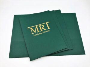 A green folder with MRT Landscape Division logo printed on it from a custom print shop in Port Charlotte.